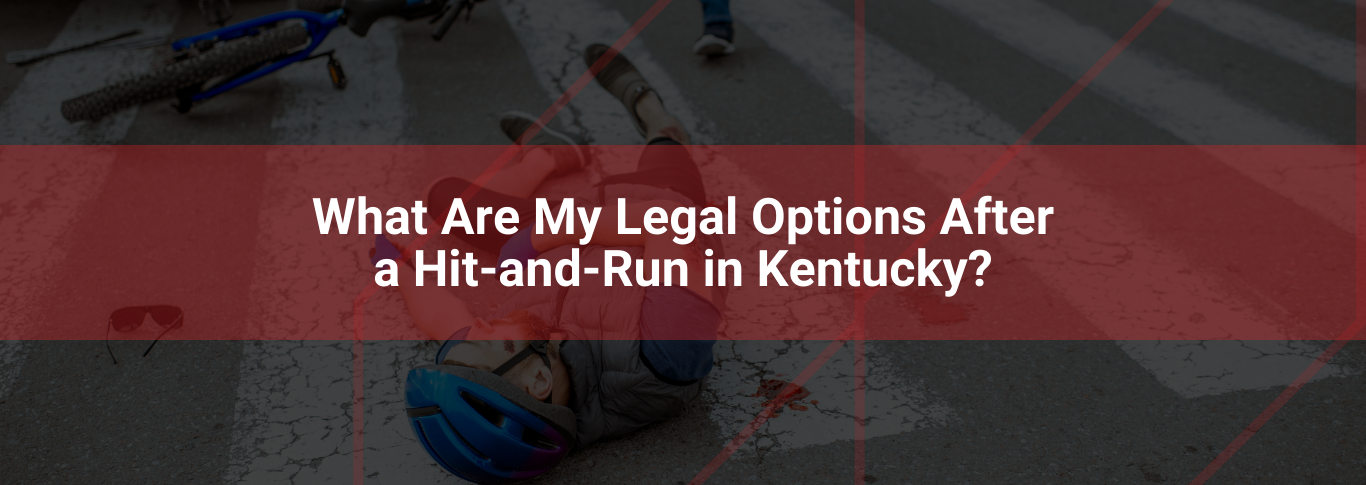 Bicycle accident scene on a crosswalk with injured cyclist, overlay text asking about legal options after a hit-and-run in Kentucky.